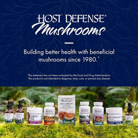 Flacon de 30 ml d'extrait MyCommunity de Host Defense sur une table en bois