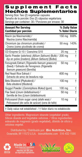 Flacon de capsules Bio Nutrition Cholesterol Wellness sur une table en bois