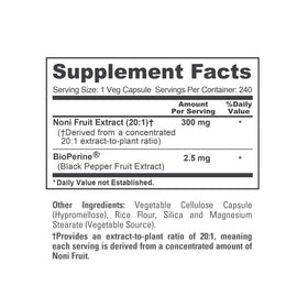 Flacon de capsules Noni Fruit sur une surface en bois