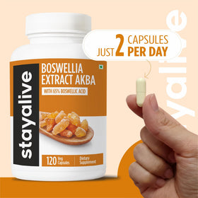 Flacon de capsules STAY ALIVE Boswellia Serrata sur un fond naturel