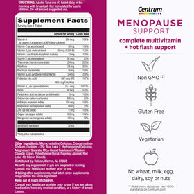 Flacon de Centrum Multivitamine Complète sur une table avec des fruits