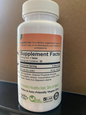 Flacon de comprimés de Zinc 50mg FORTE NATURALS ouvert avec comprimés visibles