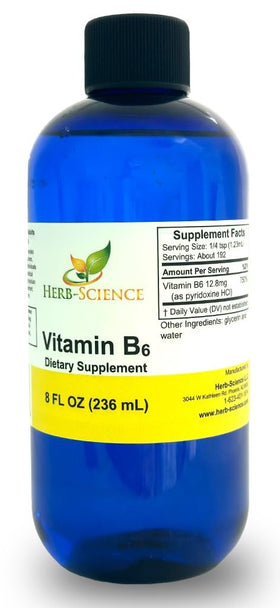 Flacon de Gouttes de Vitamine B6 Herb-Science sur une table