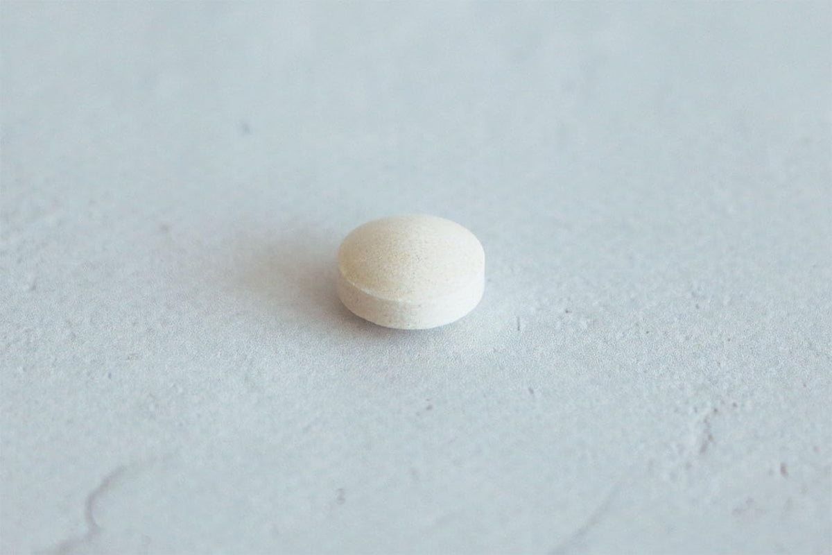 Flacon de KINJIRUSHI Complément Alimentaire avec tableau des dosages