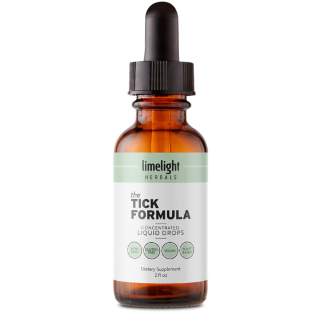 Flacon de la Formule Anti-Tiques LIMELIGHT HERBALS posé sur une table en bois