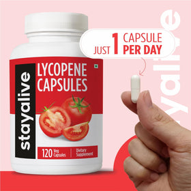 Flacon de lycopène STAYALIVE sur une table en bois
