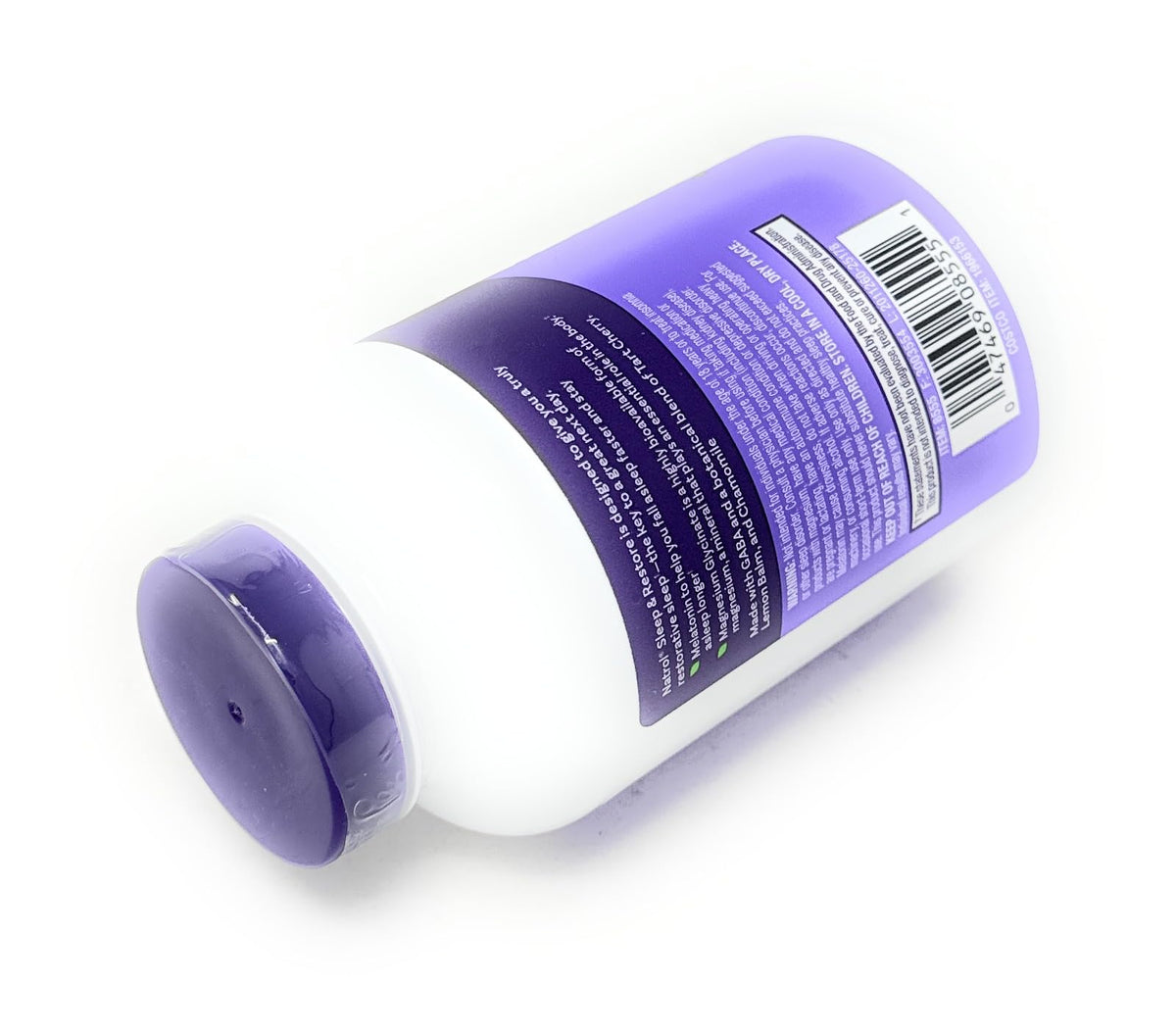 Flacon de Natrol Sommeil & Récupération ouvert avec capsules à l'extérieur