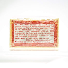 Flacon de Po Chai Pills Li Chung Shing Tong avec un verre d'eau