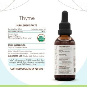 Flacon de teinture de thym bio HerbEra sur une surface en bois