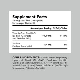 Flacon de vitamine C AMANDEAN avec des agrumes en arrière-plan