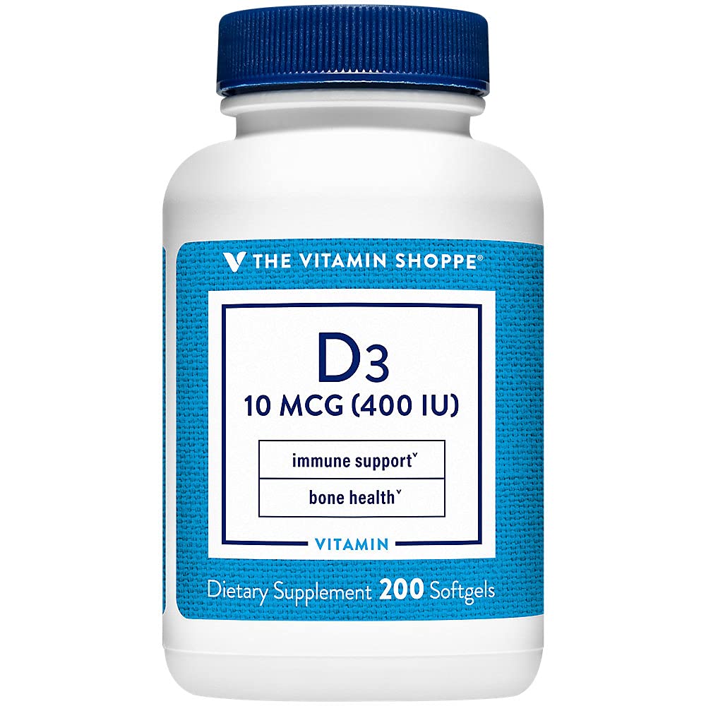 Flacon de vitamine D3 400UI ouvert avec gélules à l'intérieur