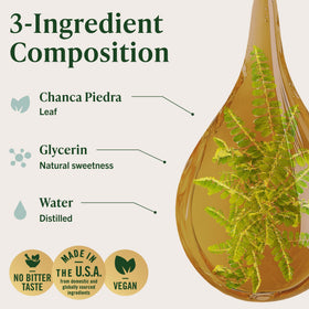 Flacon HERBAMAMA Chanca Piedra à côté d'un verre d'eau