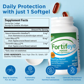 Fortifeye Focus capsules molles à côté d'un verre d'eau
