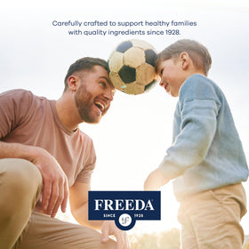 FREEDA Calcium 600mg comprimés à côté d'un verre d'eau