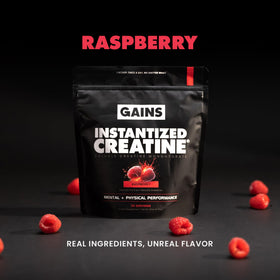 GAINS IN BULK Créatine Monohydrate Instantanée Framboise en poudre dans un verre