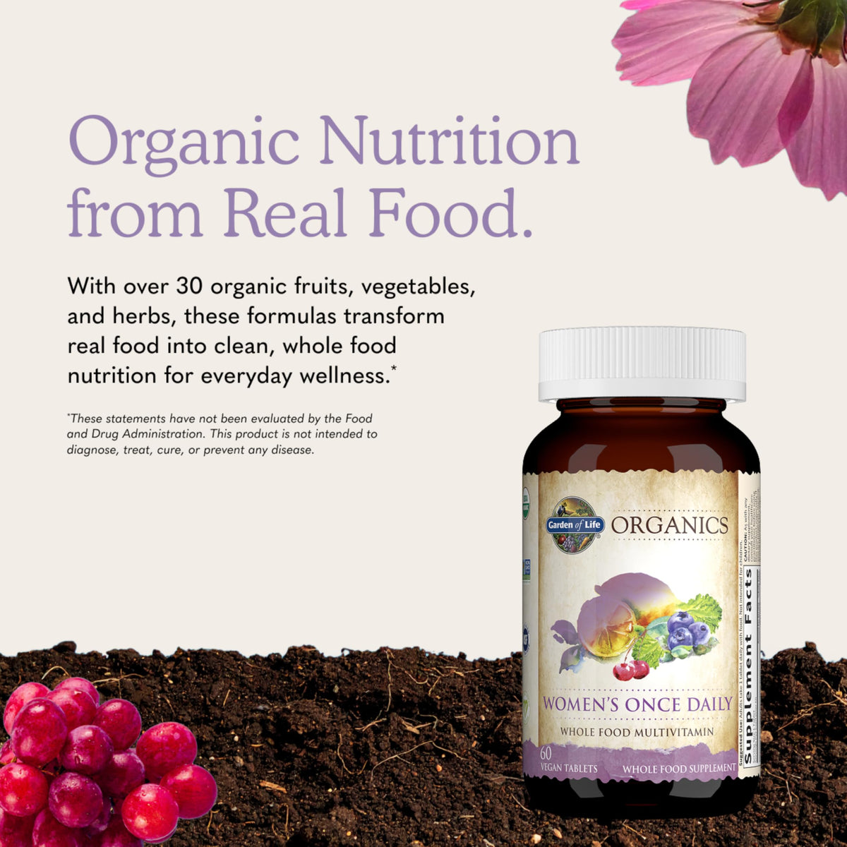 Garden of Life Multivitamines Bio Femmes 60 Tablettes à côté d'un verre d'eau