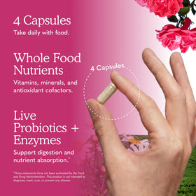 Garden of Life Multivitamines pour Femmes - capsules sur une surface en bois