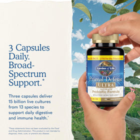 Garden of Life Primal Defense Ultra capsules with a glass of water