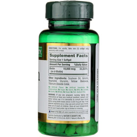 Gélules de biotine Nature's Bounty sur une table en bois