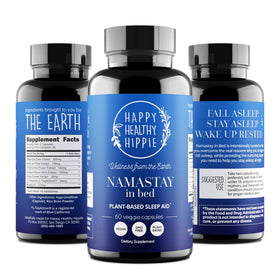 Gélules de Namastay in Bed sur une surface en bois