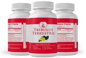 Gélules de Tribulus Terrestris PURE ORIGINAL INGREDIENTS à côté d'un verre d'eau