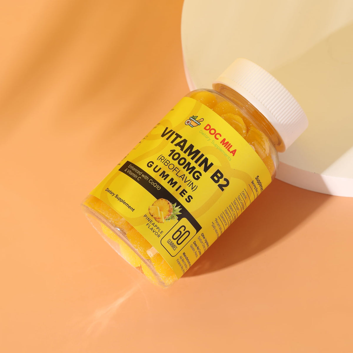 Gélules de vitamine B2 Doc Mila 100mg sur une table en bois
