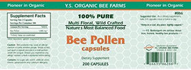 Gélules de YS Organic Pollen d'abeille près d'un fond naturel