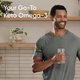 Gélules Omega-3 de Sports Research dans une main