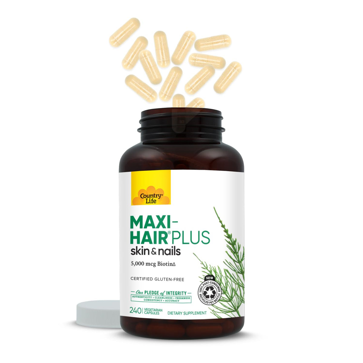 Gélules végétariennes Country Life Maxi-Hair Plus Biotine sur une main