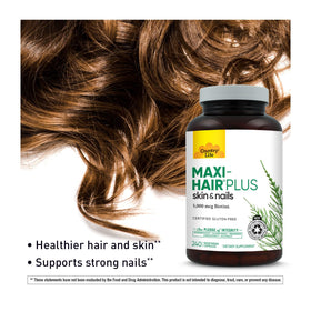 Gélules végétariennes Country Life Maxi-Hair Plus Biotine sur une table
