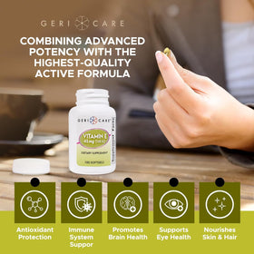 GeriCare Vitamine E 100 IU gélules à côté d'un verre d'eau