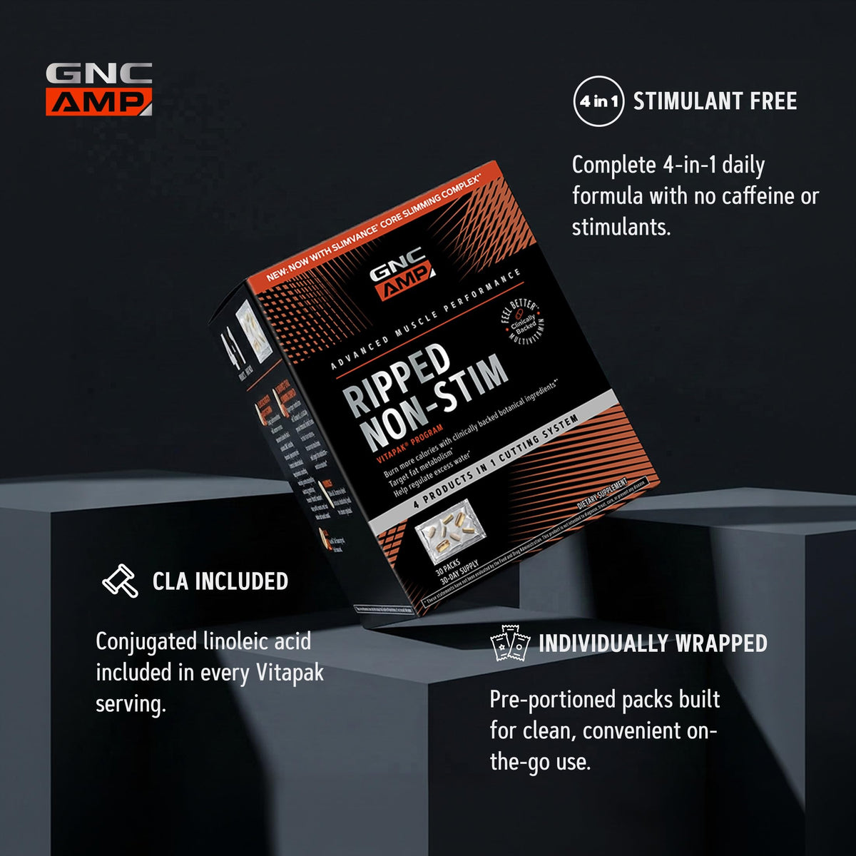 GNC AMP Ripped Vitapak sur une table avec des accessoires de fitness