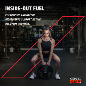 GNC Amplified Greens Blend Pomme Grenade et Myrtille 381g avec une cuillère