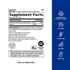 GNC Complément Alimentaire B-6 100 mg, capsules sur une surface blanche