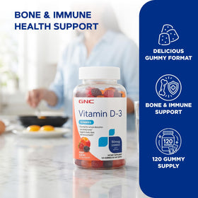 GNC Gummies de Vitamine D-3 Pêche & Baies, pot ouvert