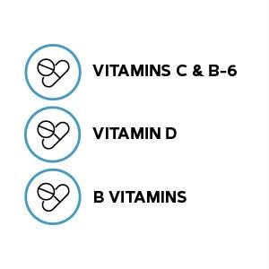 GNC Milestones Multivitamines pour Garçons 12-17, comprimés sur une surface blanche