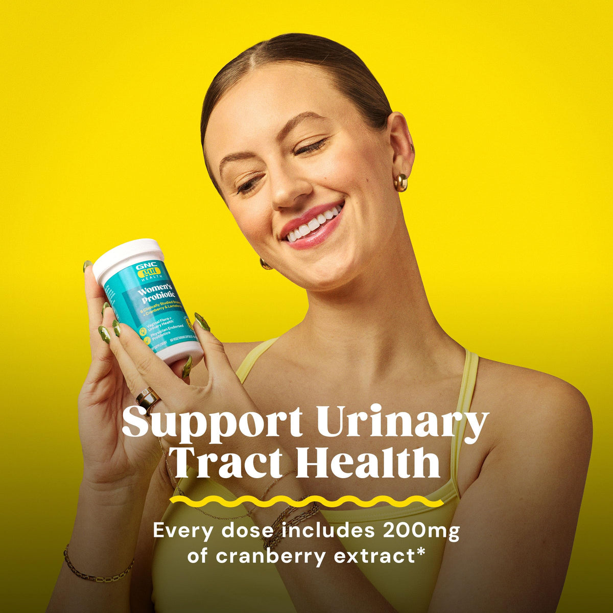 GNC Probiotic Solutions Femmes capsules en main