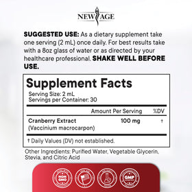 Gouttes concentrées de cranberry NEW AGE dans un verre d'eau