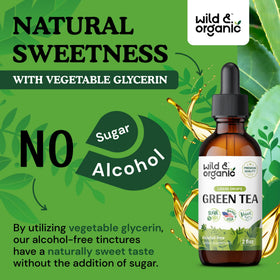 Gouttes d'extrait de thé vert Wild & Organic sur une surface blanche