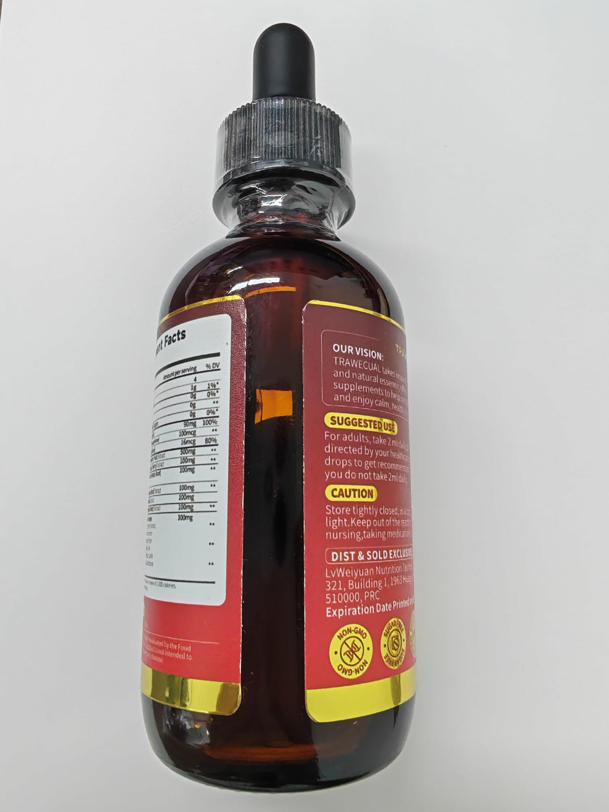 Gouttes de Complément Alimentaire Liposomal Cayenne dans une cuillère