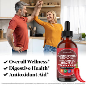 Gouttes de piment de cayenne Superfood MD avec une cuillère doseuse sur une table