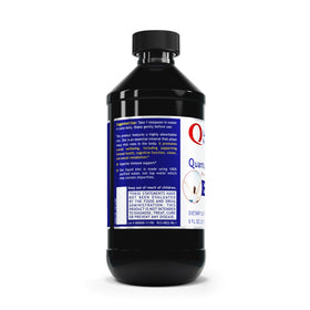 Gouttes de Zinc Liquide Quantum Nutrition dans un verre d'eau