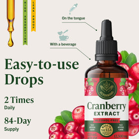 Gouttes du complément HERBAMAMA Cranberry sur une cuillère
