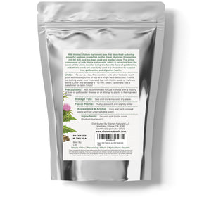 Graines de chardon-marie Elanen Naturals sur une cuillère en bois