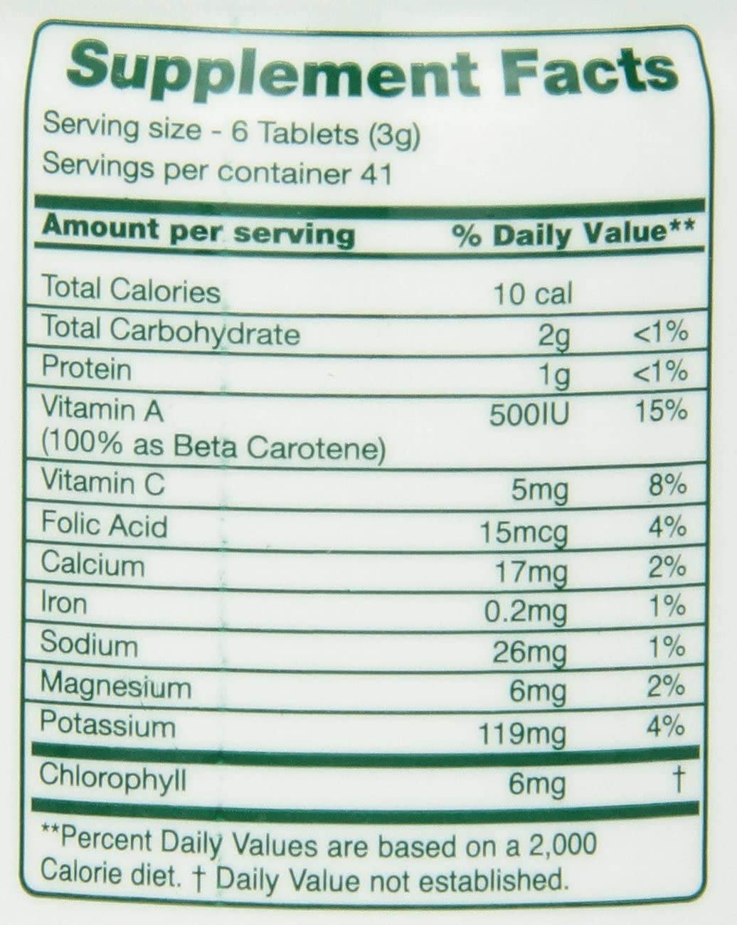 Green Foods Green Magma 500 comprimés et un verre d'eau