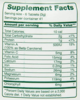 Green Foods Green Magma 500 comprimés et un verre d'eau