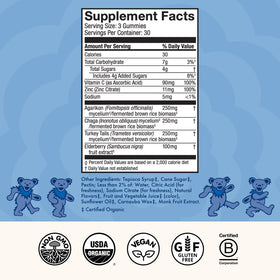 Gummies Beary Well de Host Defense sur une surface en bois