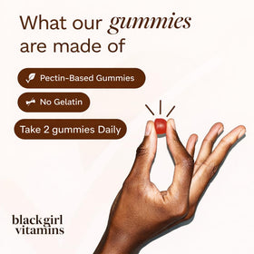 Gummies Black Girl Vitamins sur une table avec des fruits frais