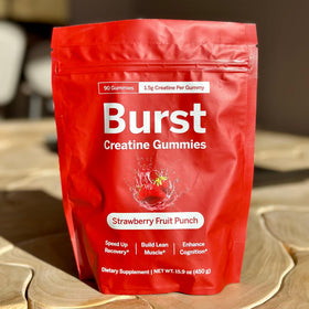 Gummies Burst Creatine sur une table de cuisine avec des fruits
