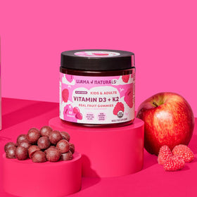 Gummies D3 Vegan avec une framboise à côté